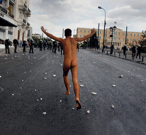Speaking the naked truth to power, this Greek protester brings his anti-austerity message to parliament in Syntagma Square Athens.
