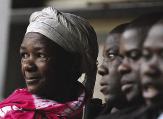 Looking forward in hope. A woman waits in line to cast her vote at a primary school in Nairobi's slum district of Kibera in August 2010. Noor Khamis / Reuters