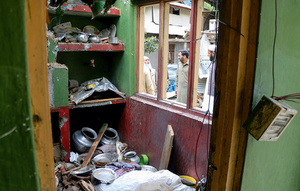 Possessions lie scattered across a home damaged by an Indian strike in Neelum Valley, Pakistan-administered Kashmir, on 13 May 2025. Photo: Stringer/Reuters