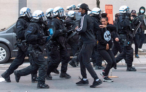 The SVPM push back protestors at a Black Lives Matter march in May 2020. In a city with a highly militarized police force, annual demonstrations against police brutality have been held in Montreal for nearly 20 years. Photo: Graham Hughes/Alamy
