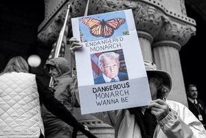 A protester accuses Trump of authoritarian overreach over the arrest of Wisconsin Judge Hannah Dugan for allegedly blocking ICE agents from detaining a Mexican man. She appeared in court on 15 May 2025. Photo: Reuters/Jim Vondruska