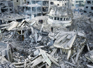 Palestinians inspect the rubble of the Yassin Mosque at Shati refugee camp in Gaza City. It was hit by  hit by an Israeli airstrike on 9 October 2023. Photo: Adel Hana/Associated Press/Alamy