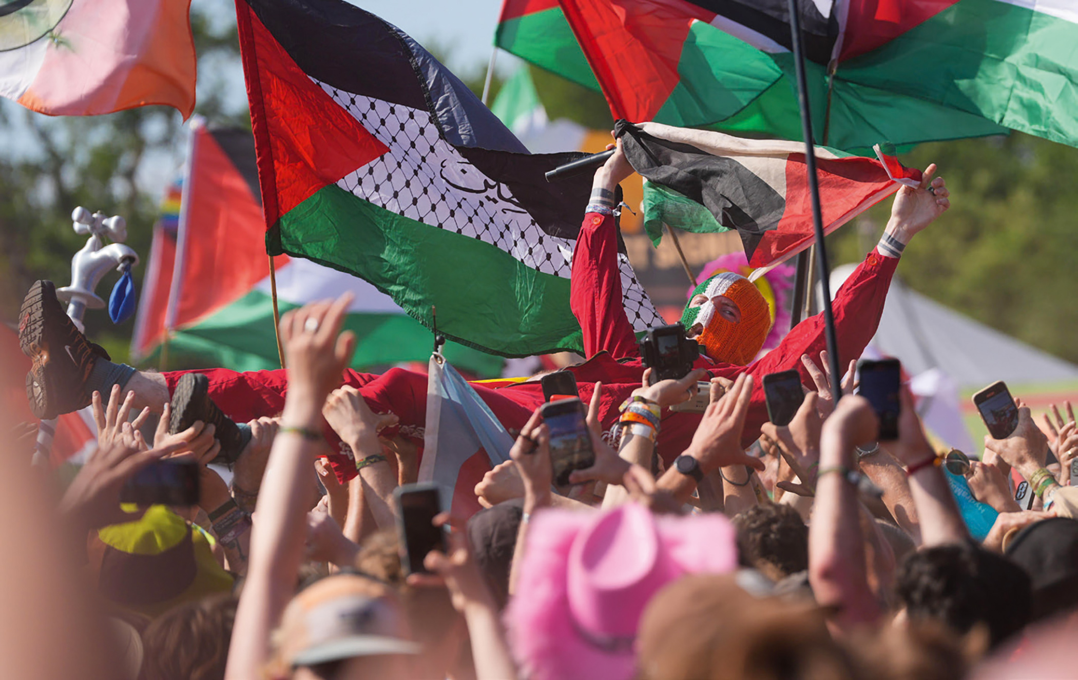 DJ Próvaí surfs the crowd at Glastonbury’s West Holts Stage this year.