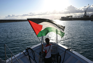 An activist sails on a boat in solidarity with Palestinians at Italy’s Genoa port on 13 July 2025.Photo: Piero Cruciatti/Alamy Live News