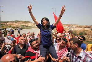 Palestinian politician Khalida Jarrar is lifted up by jubilant supporters in Tulkarem, West Bank, after her release from an Israeli jail on 3 June 2016. Jarrar has been repeatedly imprisoned without charge or trial in Israel’s prison regime.Photo: Nedal Eshtayah/APA Images/ZUMA Wire/Alamy Live News