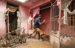 A man tries to avoid a pool of mud in Petit Goâve, Haiti, on 31 October 2025, after Hurricane Melissa brought heavy rains and deadly flooding.Photo: Egeder PQ Fildor/Reuters