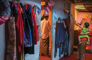 A Rohingya family prepare for evening prayers in Kuala Lumpur, Malaysia, on 5 May 2020. Once a safe haven for Rohingya, the refugee community now says Malaysia is treating them 'like criminals'.Photo: Afif Abd Halim/Nurphoto/Alamy