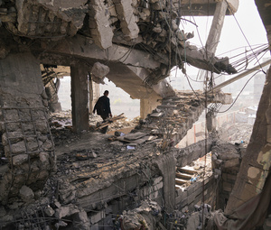 A Palestinian walks through the ruins of a building damaged by an Israeli strike the day before, in Gaza City, 20 November 2025. The ceasefire supposedly took effect on 10 October, but has been routinely ignored by Israel.Photo: Jehad Alshrafi/Associated Press