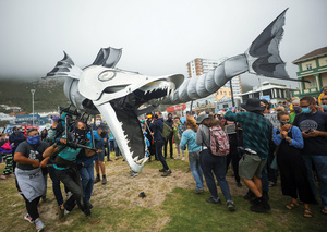 People at Muizenberg Beach, Cape Town, protest against Shell’s plans to start seismic surveys off South Africa’s Wild Coast on 5 December 2021.Photo: Mike Hutchings/Reuters