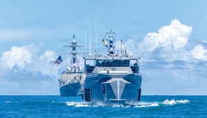 US Navy guided-missile destroyer USS Winston S Churchill, left, patrols with the Guyana Defence Force patrol vessel GDFS Shahous, right, during operations in the Caribbean Sea on 22 November 2025.Photo: MC2 Rylin Paul/US Navy Photo/Alamy Live News