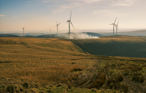 Wind farms dot the South Wales Valleys. Pen y Cymoedd, the largest onshore wind farm in England and Wales, powers one in six homes in Wales. Owned by a Swedish company, the farm offers few jobs to local people. In contrast, community wind projects like Awel Aman Tawe are generating cheaper electricity while funding local education and arts programmes.Photo: Elijah Thomas