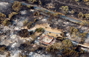 An aerial shot of homes destroyed by widlfire in a forest to the east of the Tasmanian capital of Hobart, Australia, on 5 January 2013.Photo: Chris Kid/AP/Alamy