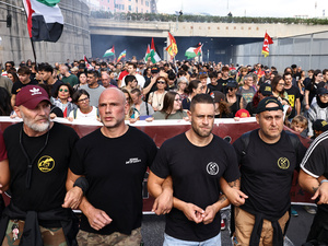 Dockworkers link arms at the front of the nationwide 'Let's block everything' protests in solidarity with Palestine in Genoa, Italy, on 22 September, 2025.Photo: Matteo Minnella/Reuters